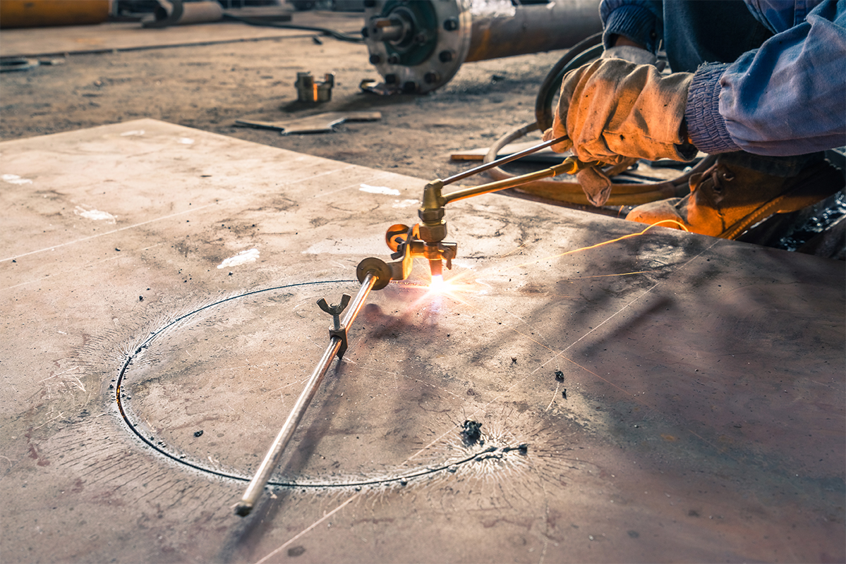 Electric wheel grinding on steel structure.